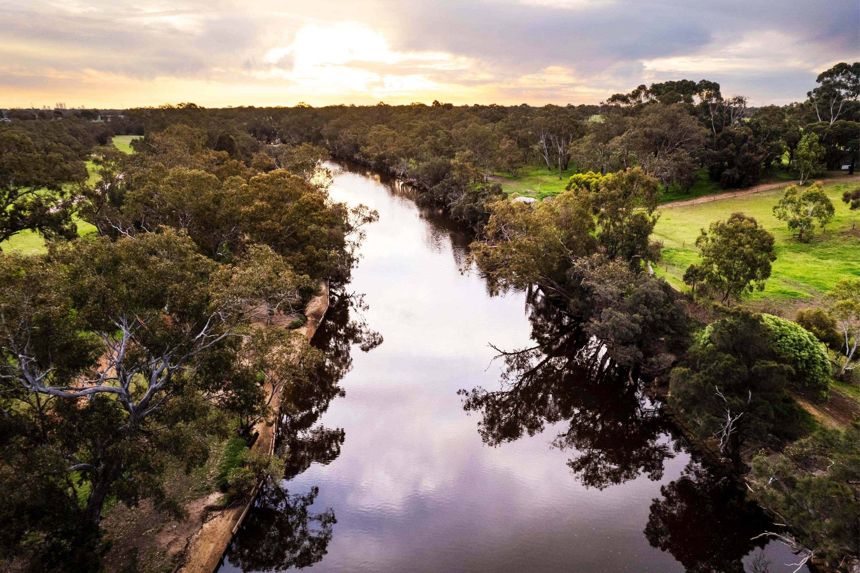 aerial view of the river in rivermark with sun shining