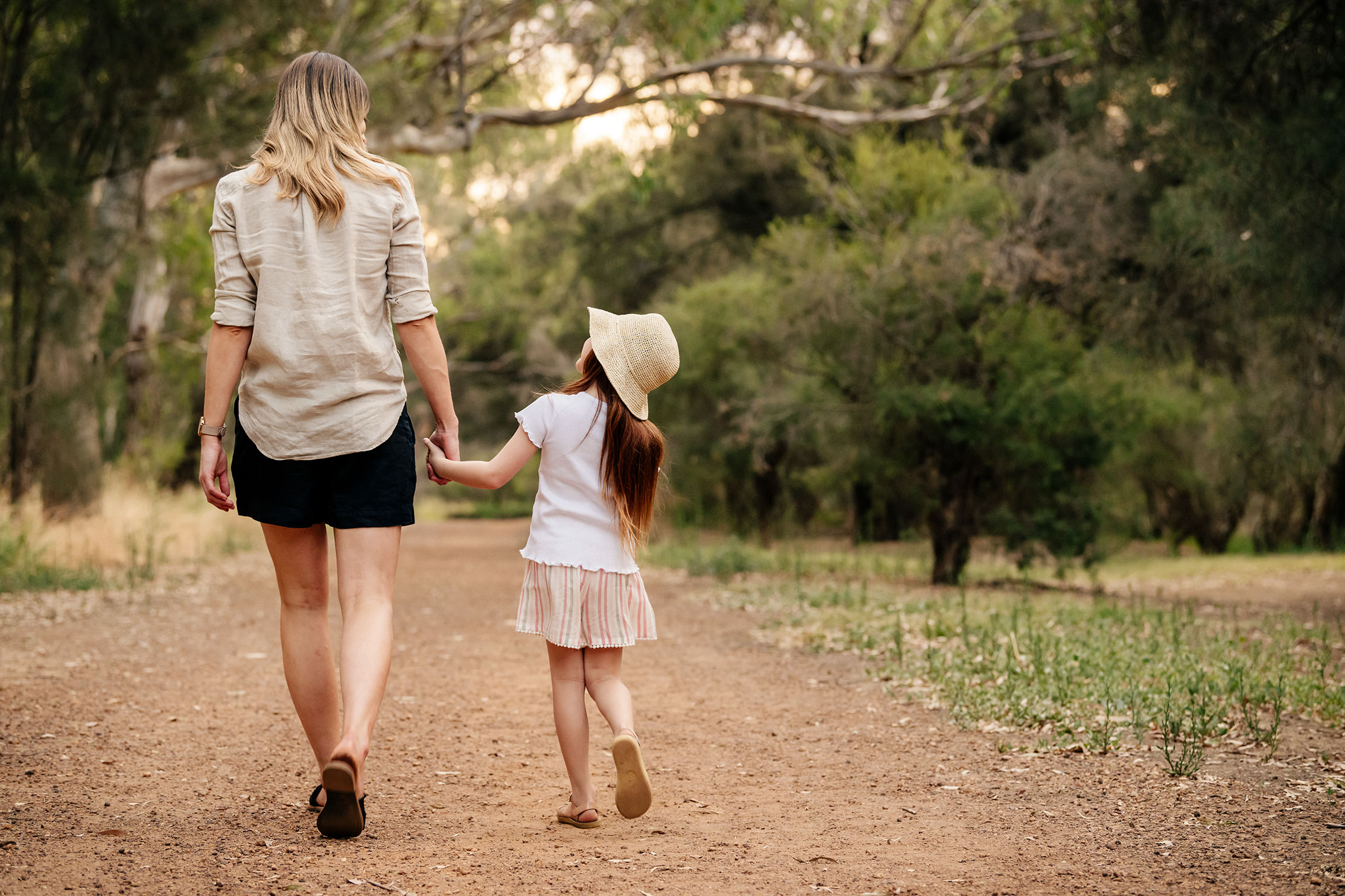 Mum And Daughter Walking In Nature