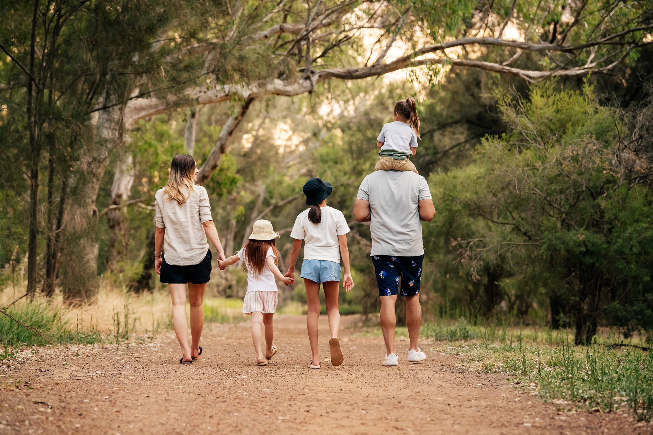 family walking through the park