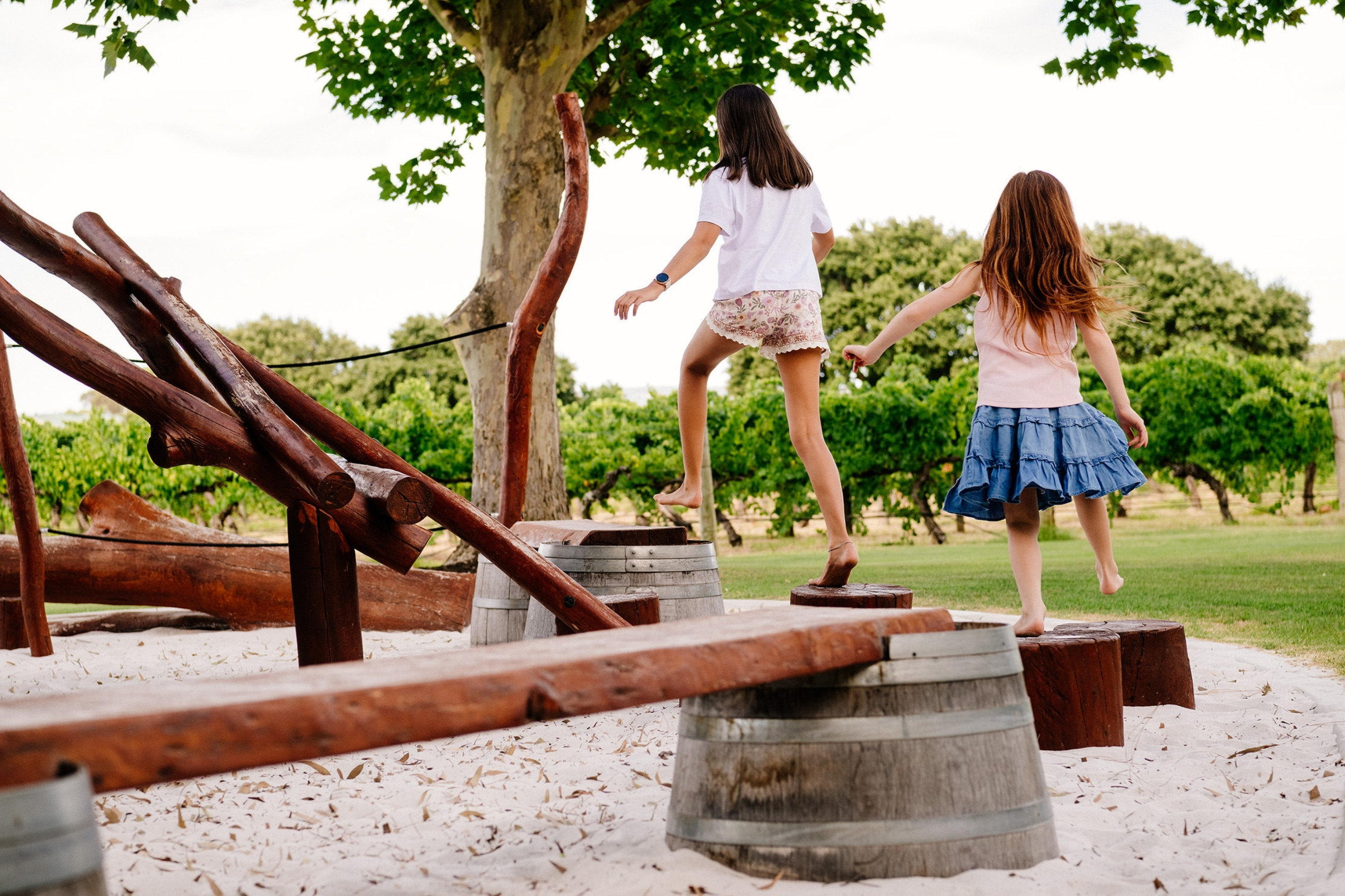 2 girls playing on the playground